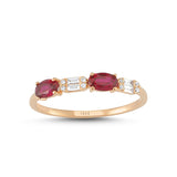 Rose gold ring with two ruby gemstones that sit beside baguette and round-cut diamonds