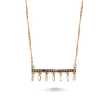 Rose gold necklace featuring a central round-cut black diamonds and dangling baguette-cut diamonds