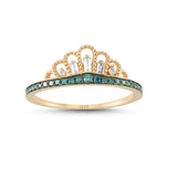 rose gold crown-shaped ring features blue diamonds at its center, surrounded by an array of baguette-cut and round-cut diamonds nestled amidst the crown's leaves