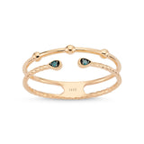 Rose gold ring featuring a double band adorned with blue diamonds